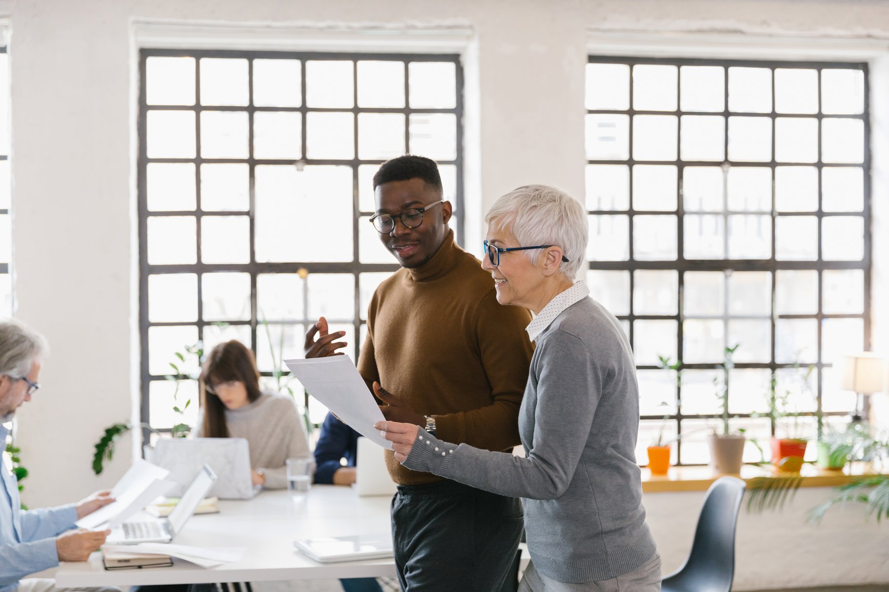 Employees talking in office