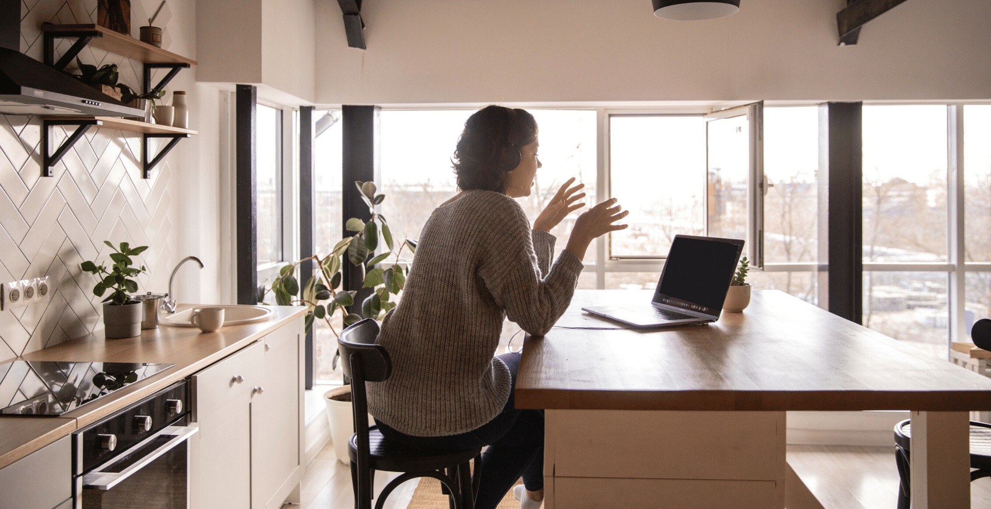 woman-female-manager-sitting-video-call-coaching-on-laptop-with-headphones