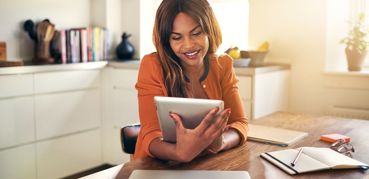 happy-woman-reads-employee-survey-data-strategy-on-tablet-at-home